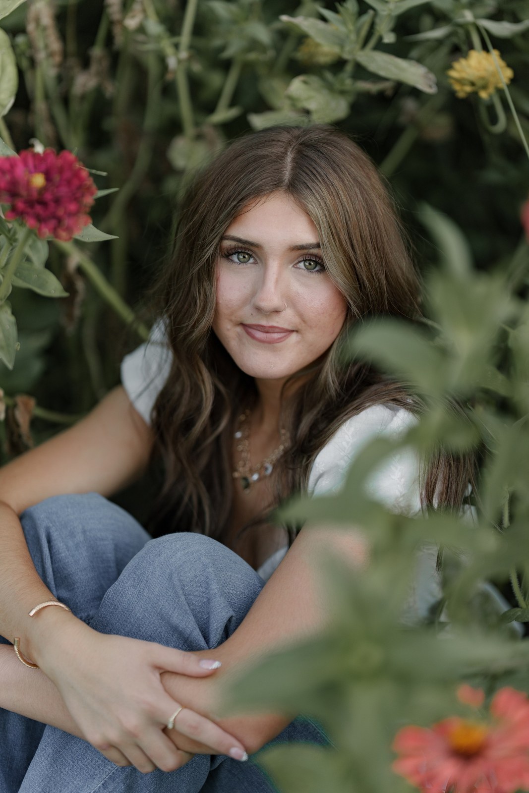 Portrait of a young woman among wildflowers