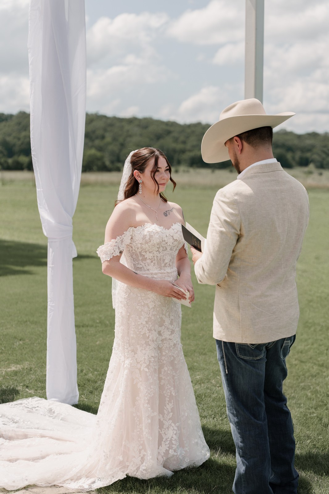 Bride and groom facing each other during their vows