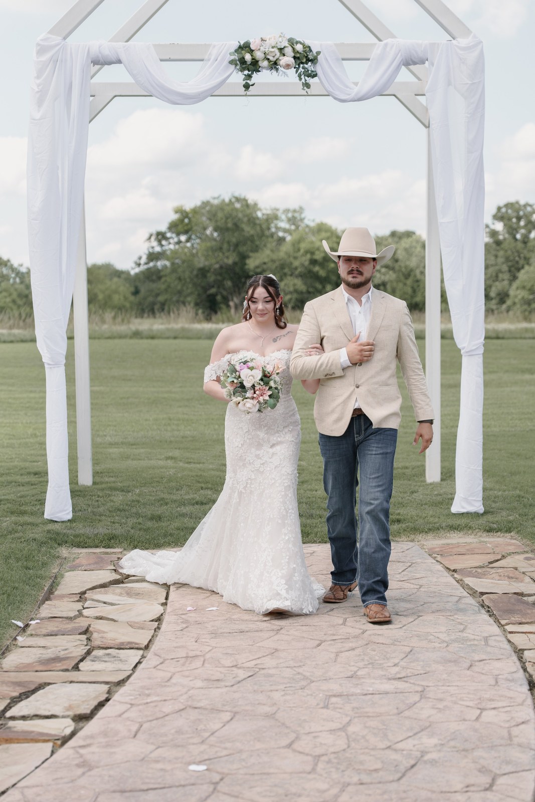 The bride walking down the aisle with her father